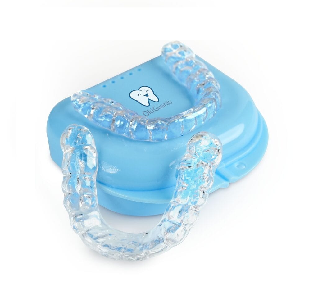 2 Two custom night guards on light blue OkiGuards travel case
