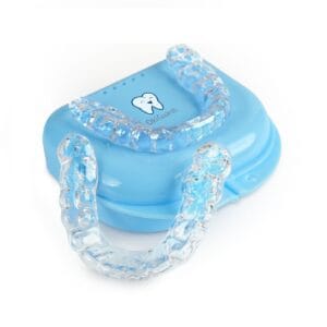 Two custom night guards on light blue OkiGuards travel case